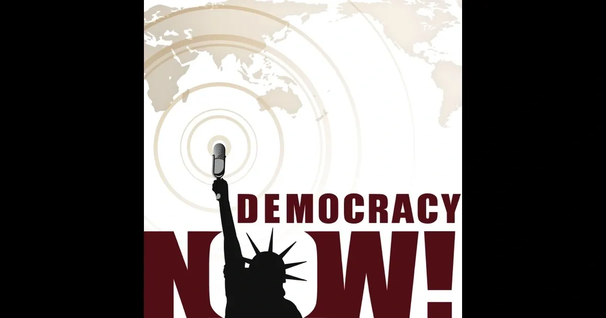 A microphone in the shape of liberty with words " democracy now !" underneath it.