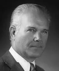 A black and white photo of an older man.